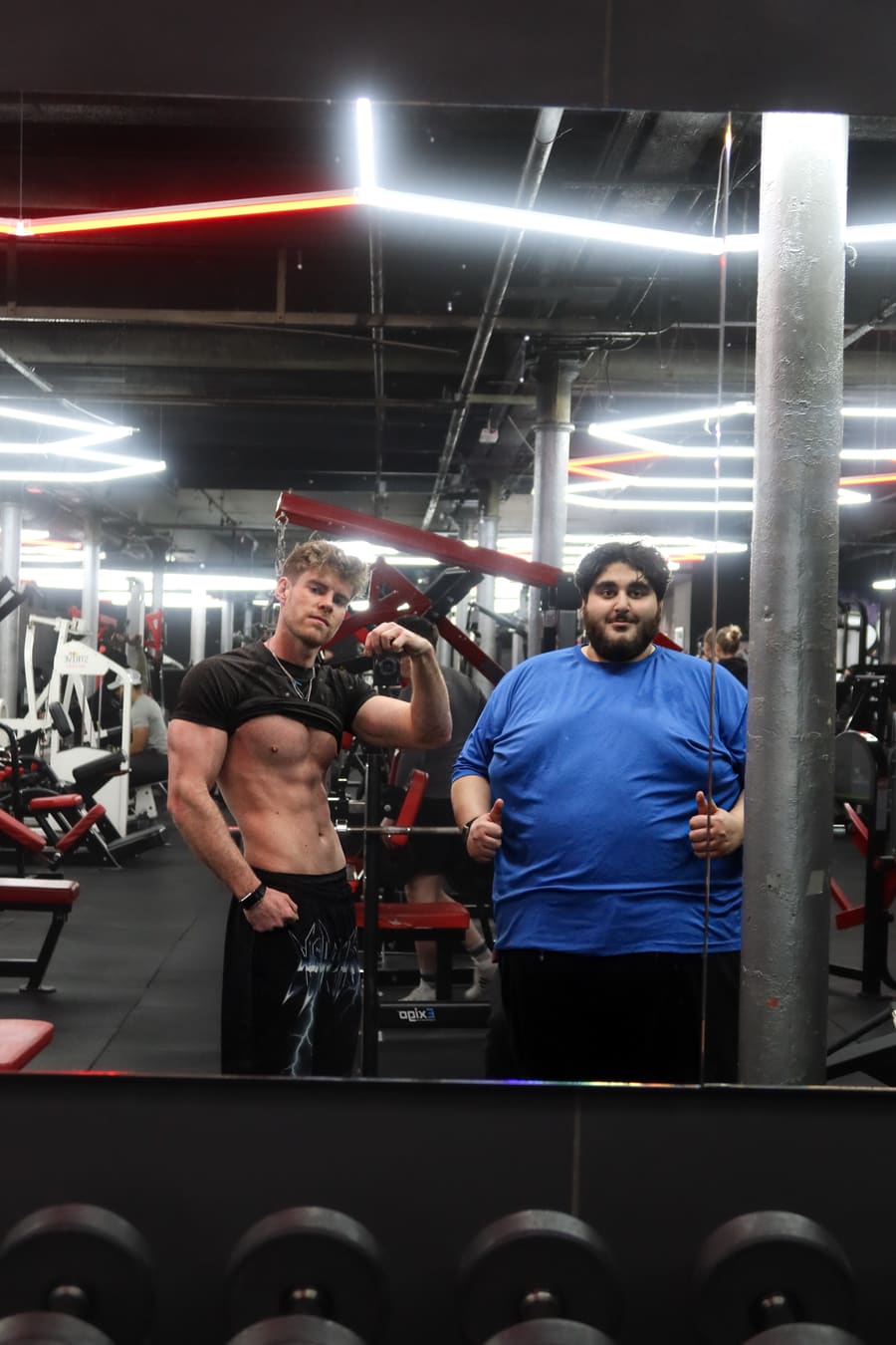 Sam and Daud in the gym mirror